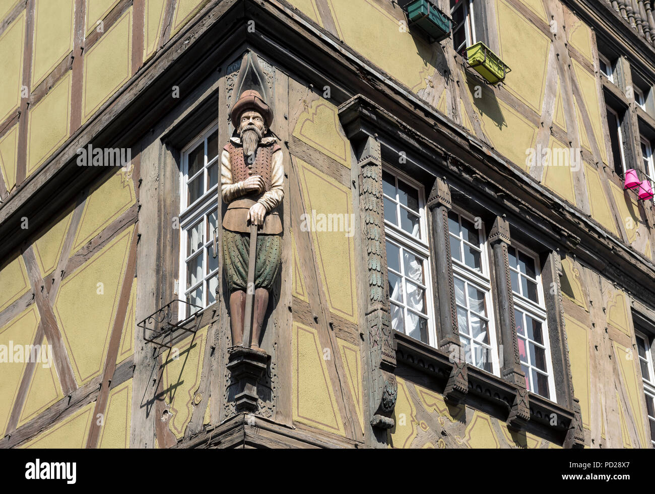 Merchant  sculpture on Maison zum Kragen at Rue des Marchands, Colmar, France Stock Photo