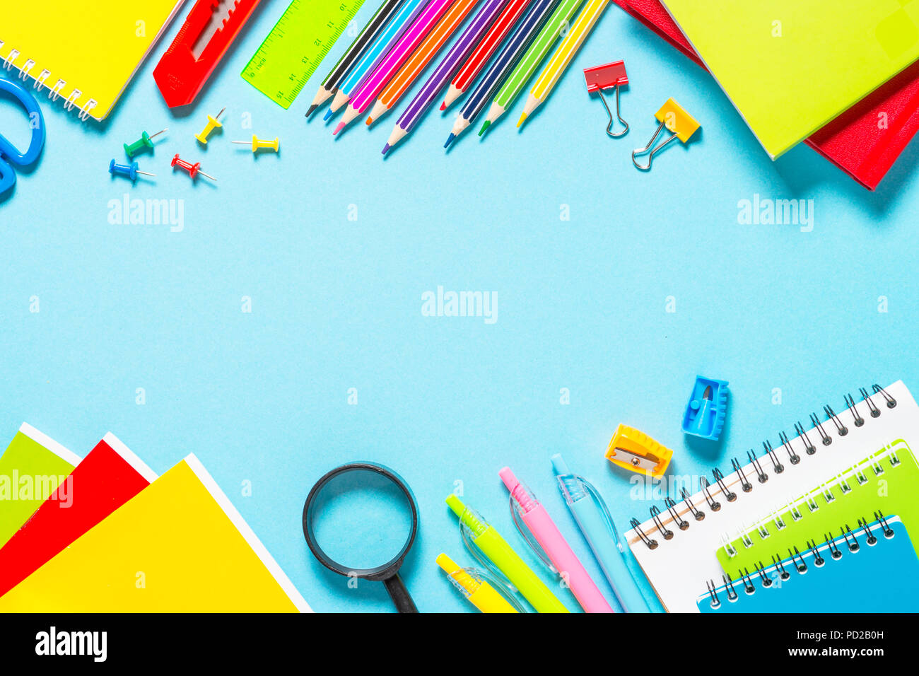 School and office supplies on blue background. Stock Photo