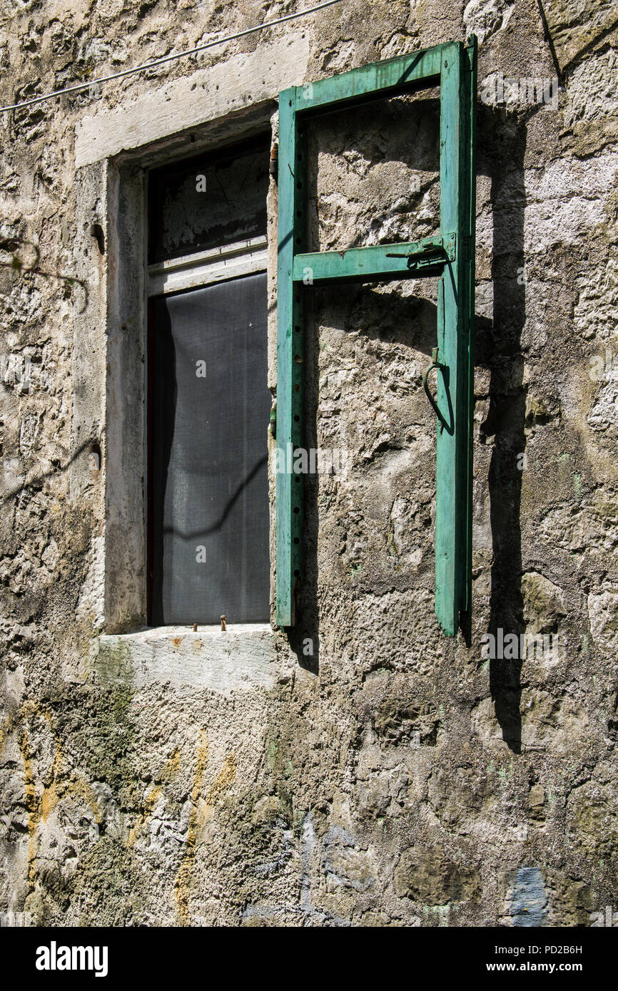 A Closed Window With Shutters Of A Stone House Stock Photo - Alamy