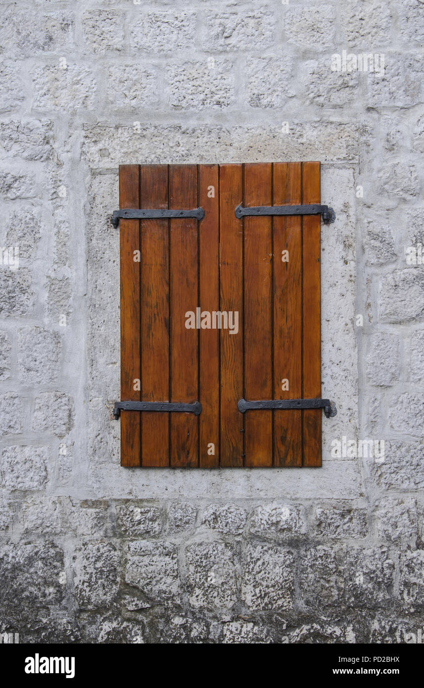 A Closed Window With Shutters Of A Stone House Stock Photo - Alamy