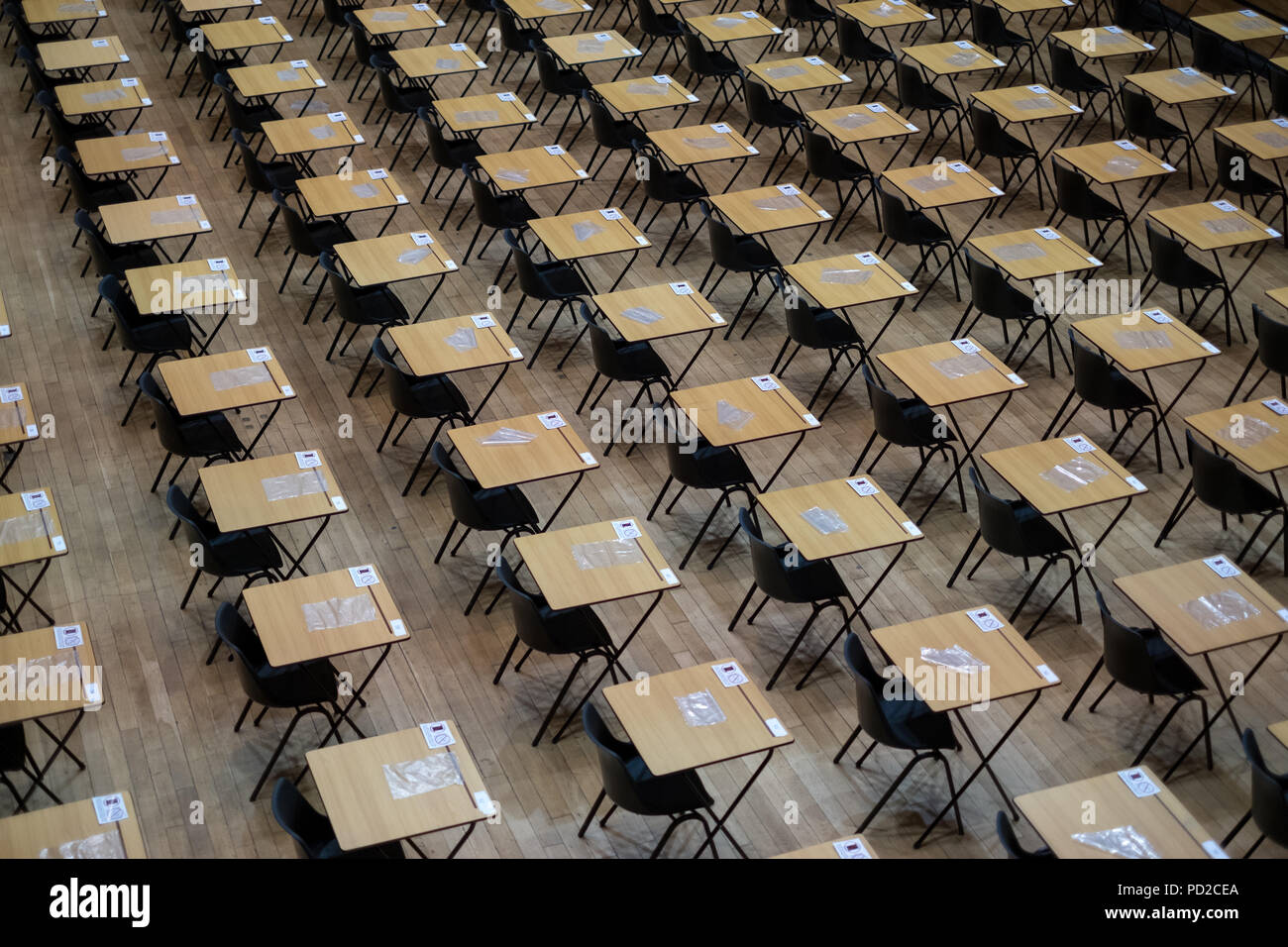 Hall with empty desks and tables, ready to be used for examination