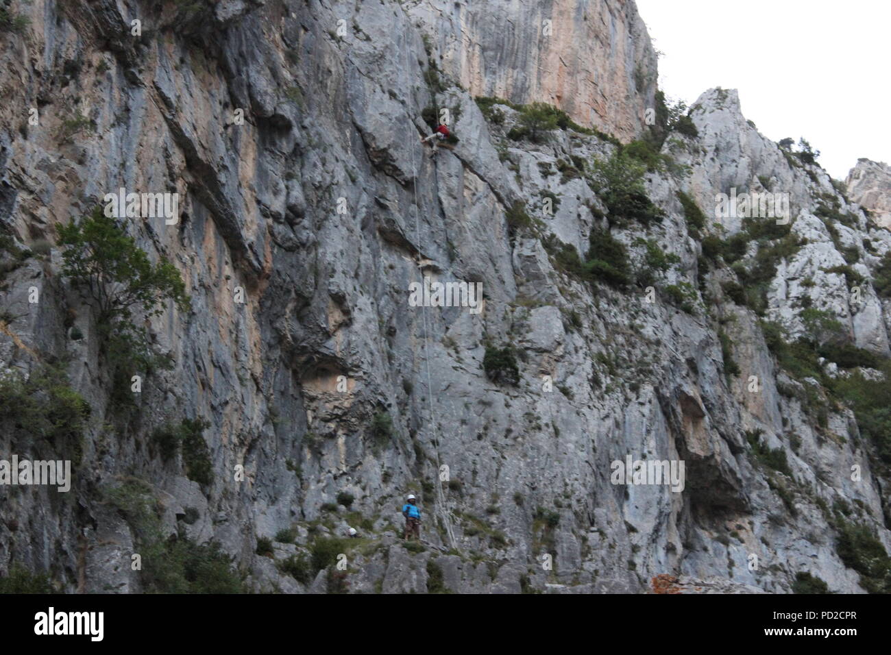 Rock climber in the spanish Pyrenees mountain range in the France