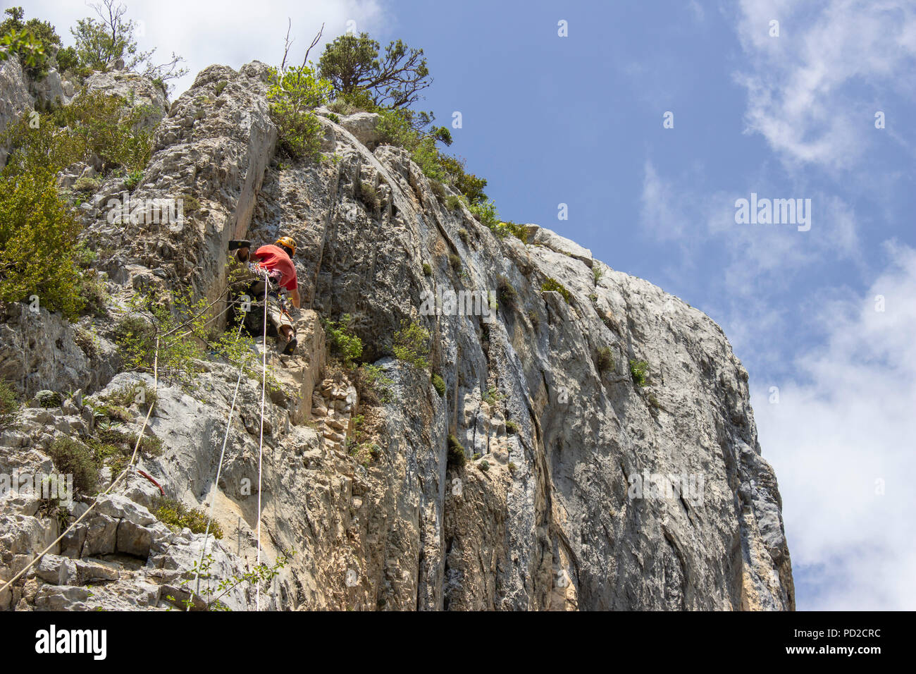 Rock climber in the spanish Pyrenees mountain range in the France