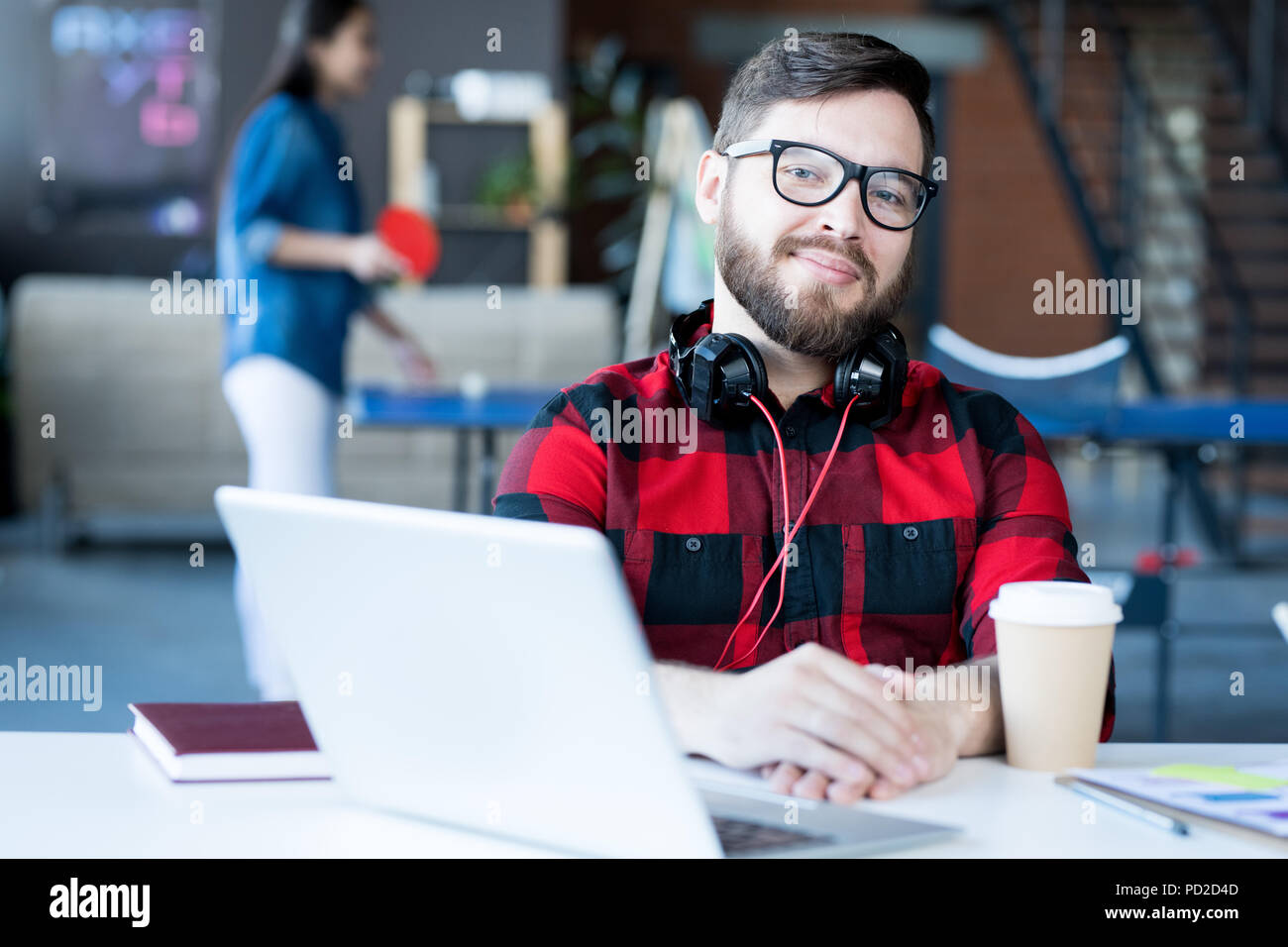 Smiling Bearded Man in IT Office Stock Photo