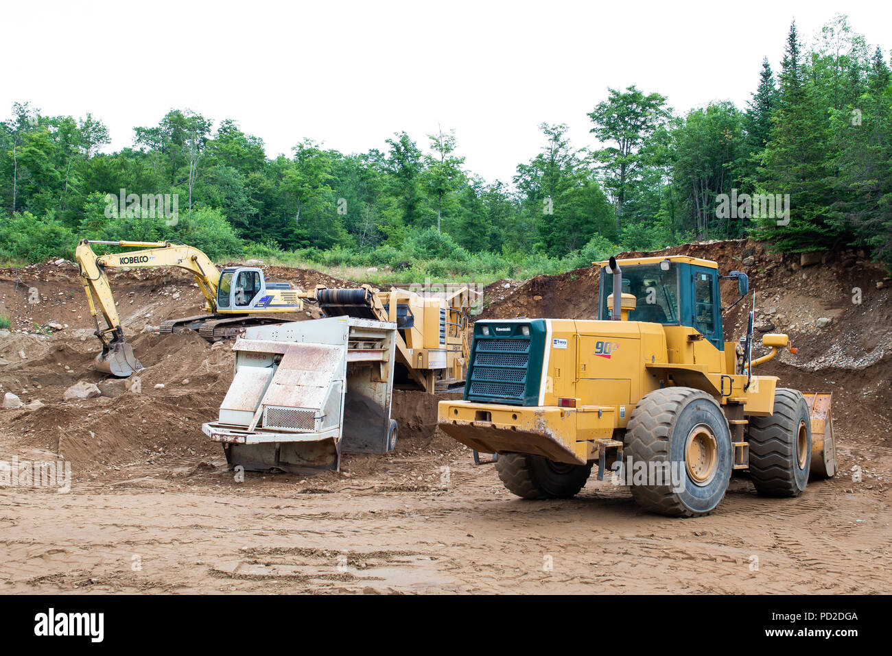 Heavy machinery working in a sand and gravel pit in the Adirondack Mountains, NY USA Stock Photo