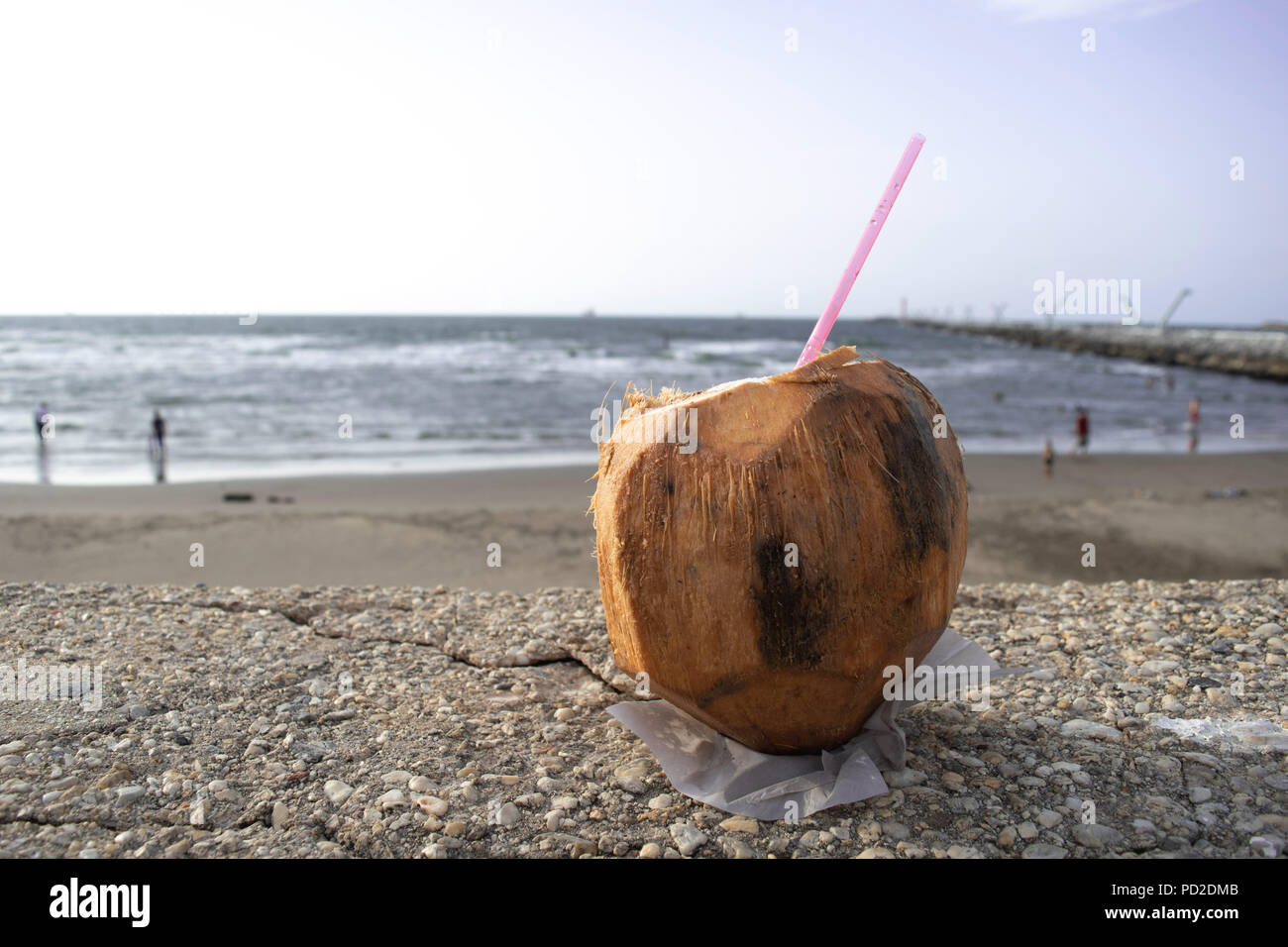 Hot summer day on the seashores of Mexico with a cold coco Stock Photo