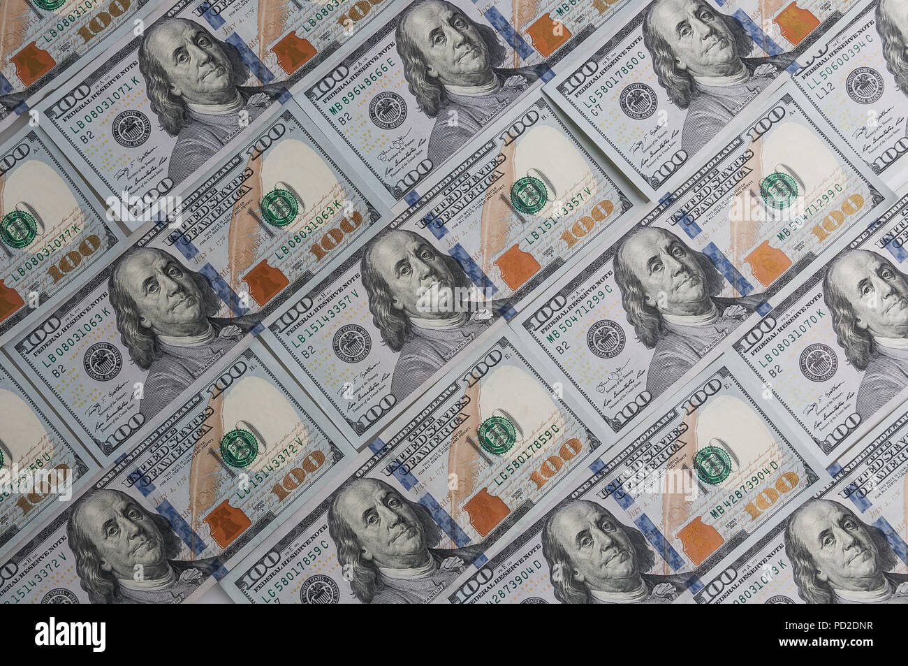 A background of one hundred dollar bills diagonally Stock Photo - Alamy