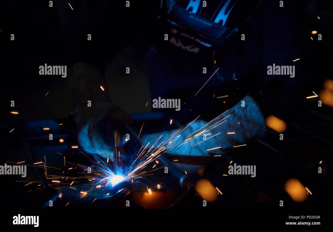 Welder at work with sparks flying Stock Photo