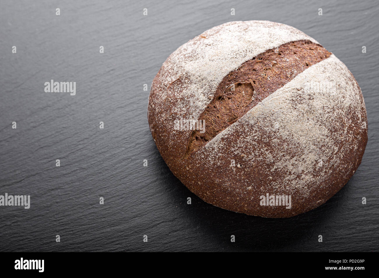 whole fresh loaf of round rye bread with a crispy crust Stock ...