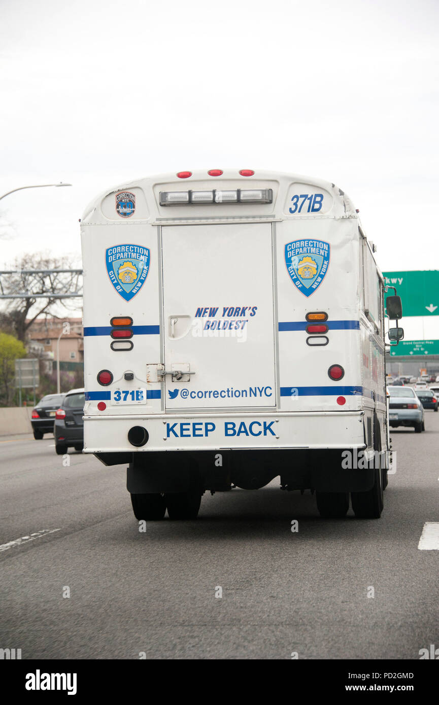 New York City Corrections bus on westbound side of Grand Central Parkway Stock Photo