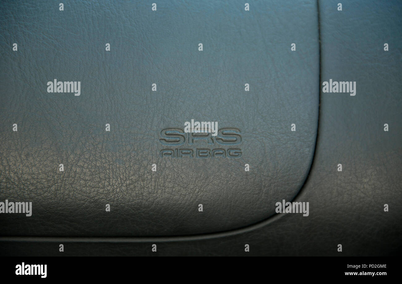 SRS airbag safety feature on steering wheel of a car Stock Photo