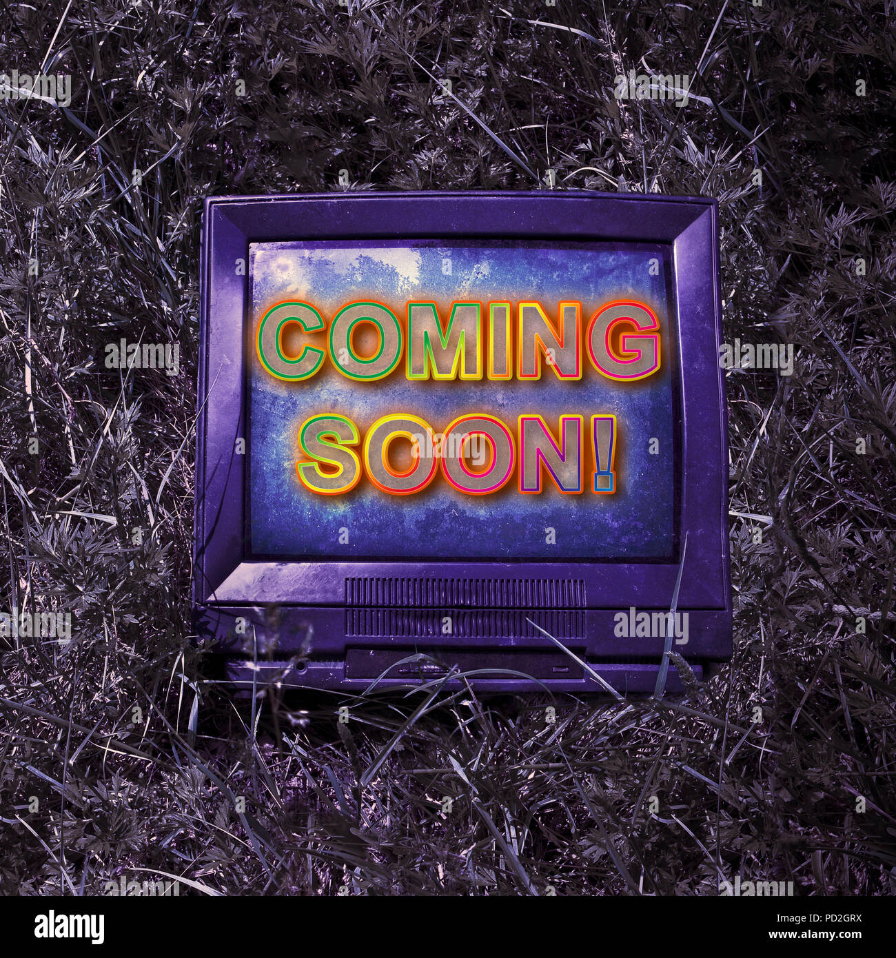 Coming soon concept written on an screen of an old CRT  (Cathode ray tube) television - toned image Stock Photo