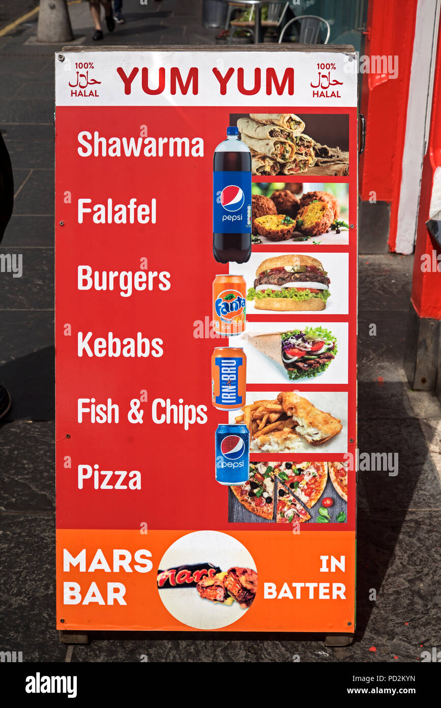 An Aboard outside Yum Yum's fast food shop on IV Bridge in