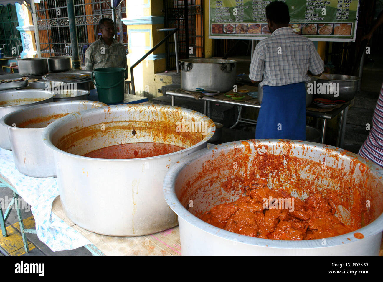Large Pots with Curry for Sale in Little India, Georgetown, Penang, Malaysia Stock Photo