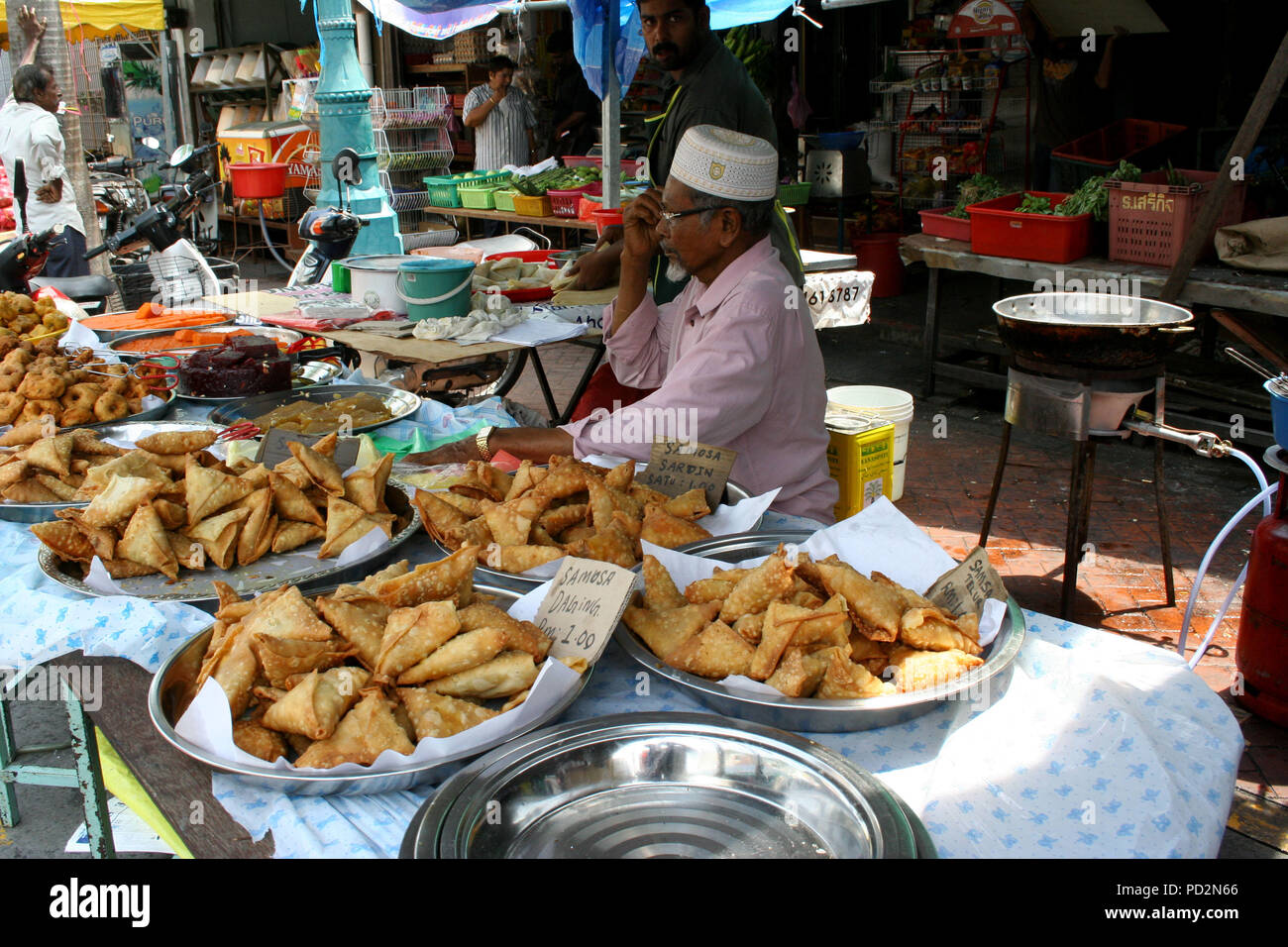 Man selling Samosas in Street Market, Little India, Georgetown, Penang, Malaysia Stock Photo