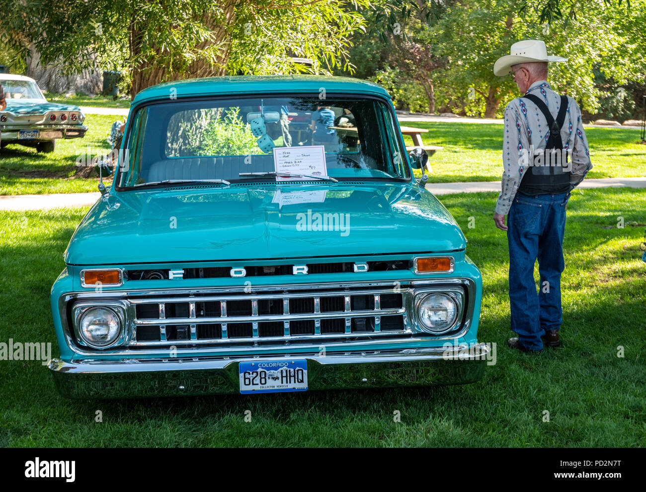 Visitor inspects 1965 Ford pickup truck; Angel of Shavano Car Show