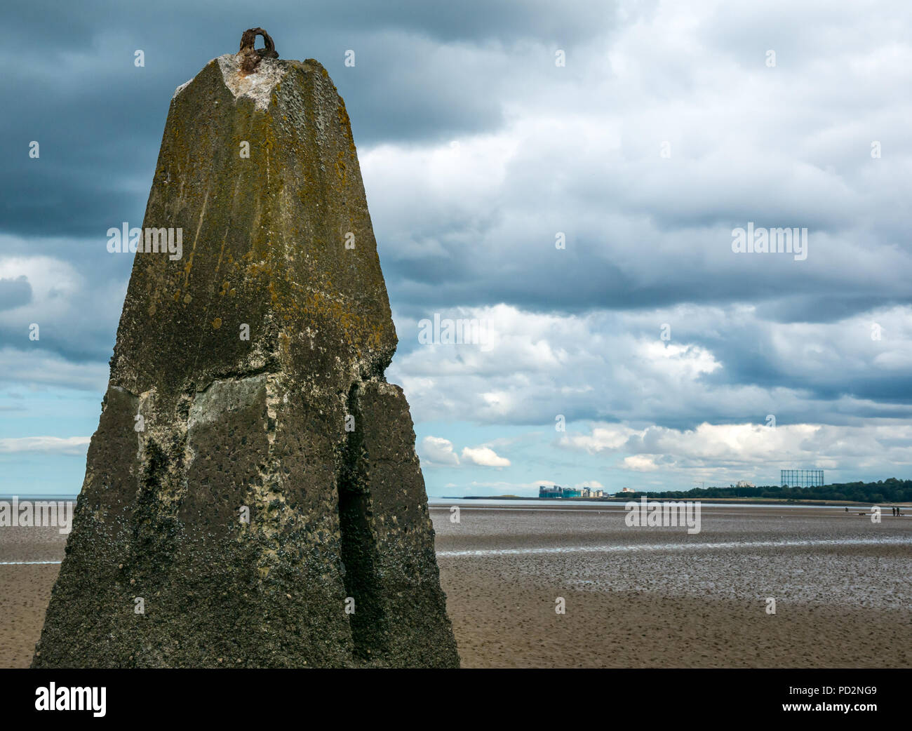 Remains of World War II concrete anti shipping barrier pylon in the Firth of Forth at low tide, Cramond, Edinburgh, Scotland, UK Stock Photo