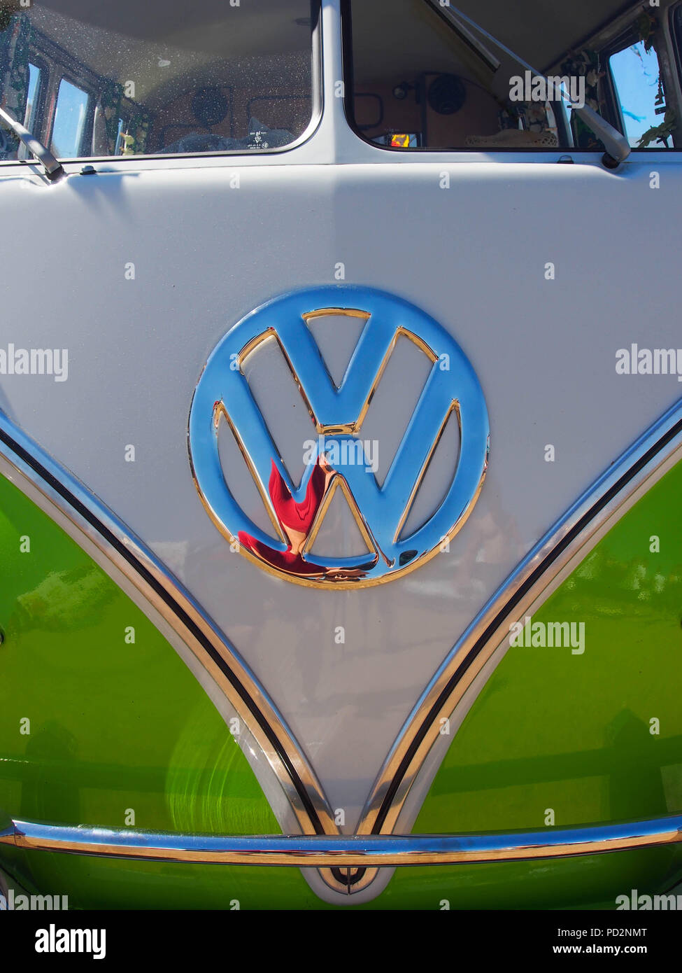 A close up of the front of a classic green VW campervan Stock Photo