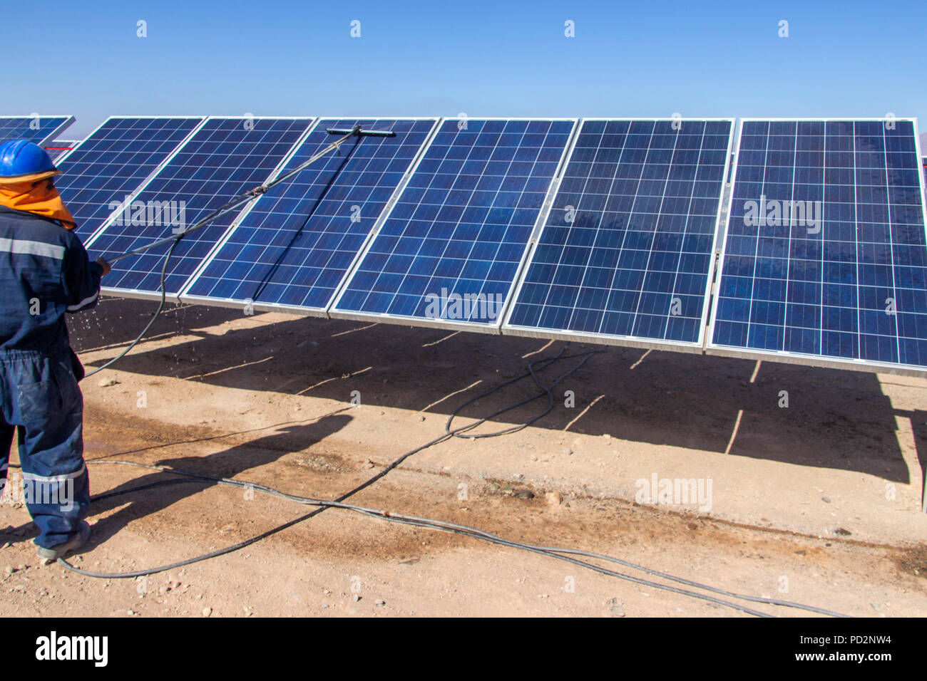 Machine cleaning PV modules, Solar Energy technology to reduce CO2 emissions and the best place for Solar Energy is the Atacama Desert at north Chile Stock Photo