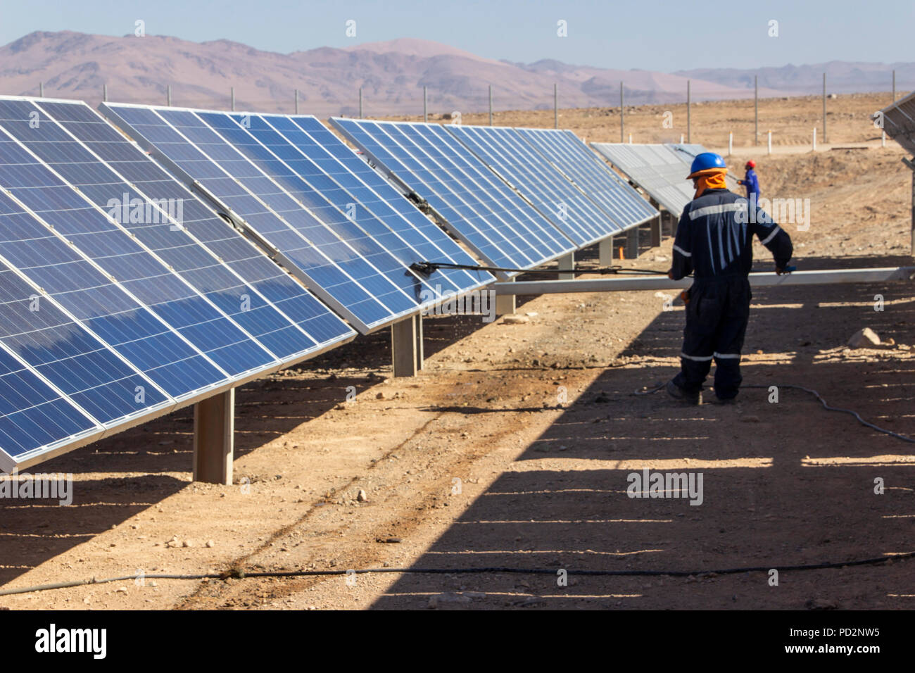 Machine cleaning PV modules, Solar Energy technology to reduce CO2 emissions and the best place for Solar Energy is the Atacama Desert at north Chile Stock Photo