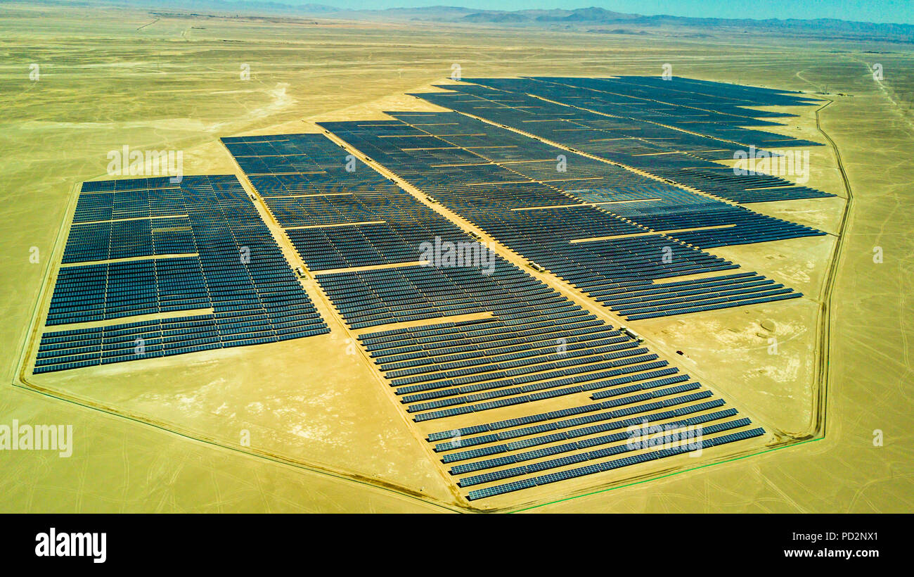 An aerial view of a Solar Energy PV Plant over the Atacama desert in Chile, trying to get the energy from the sun with Solar Energy Stock Photo
