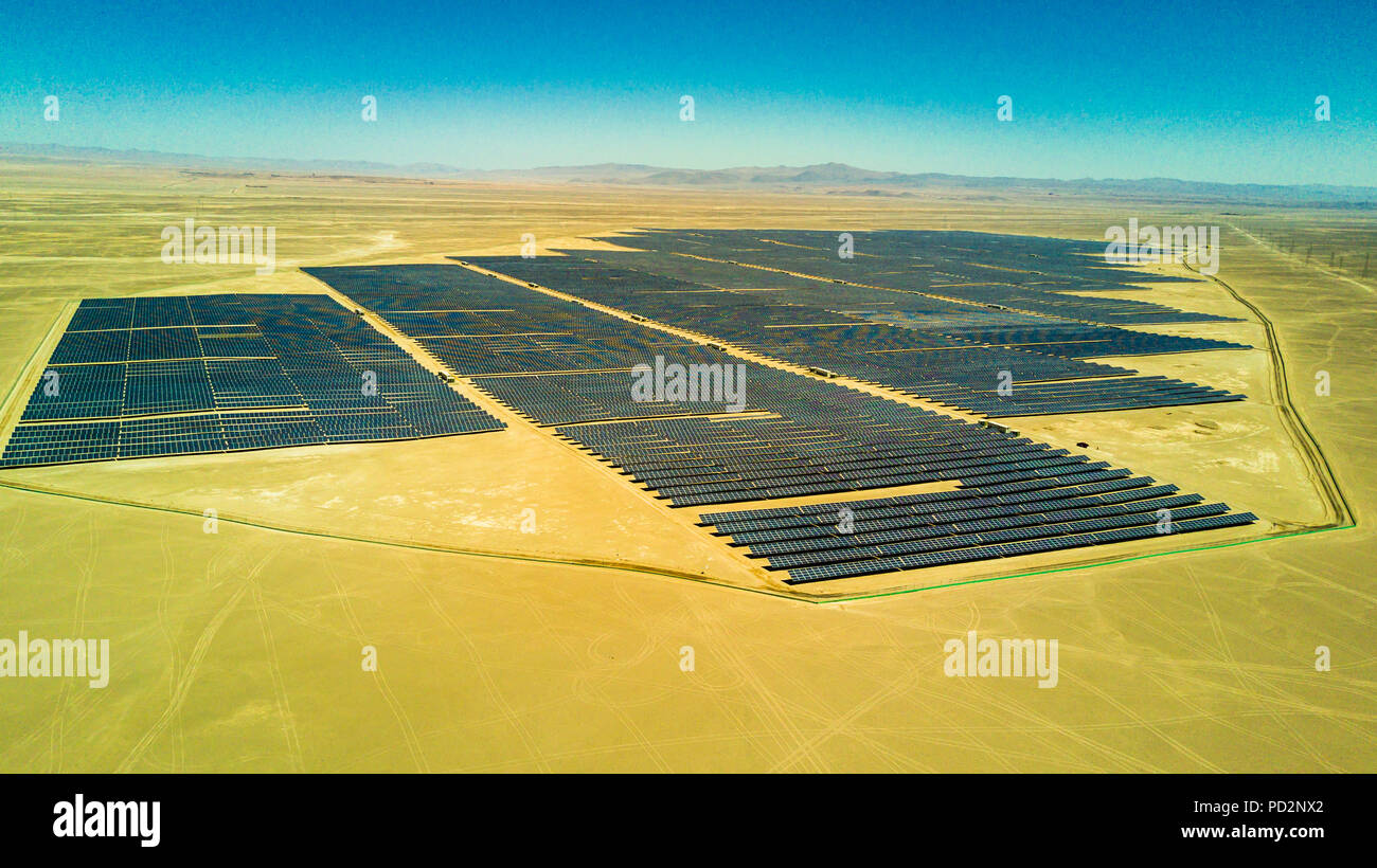 An aerial view of a Solar Energy PV Plant over the Atacama desert in Chile, trying to get the energy from the sun with Solar Energy Stock Photo