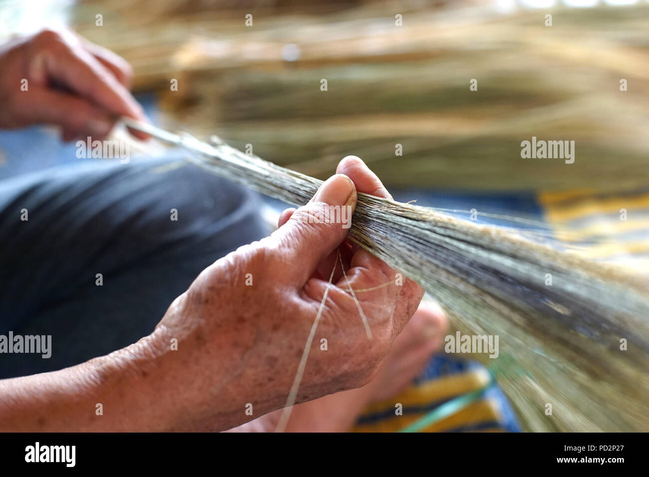 photo of women's hand is making thai broom Stock Photo
