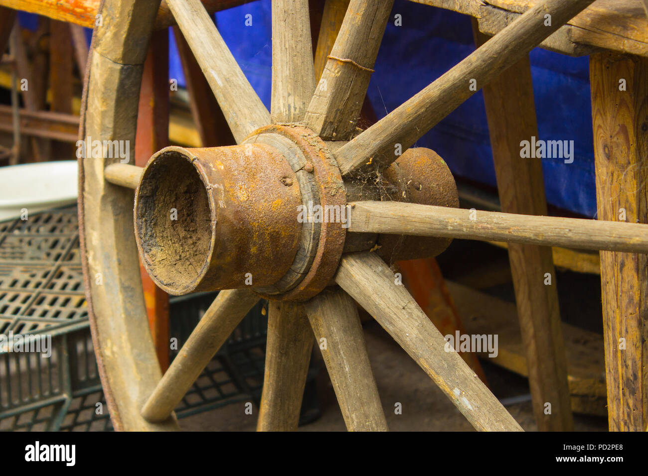 Old wooden rustic wheel with metal rim for carriage Stock Photo - Alamy