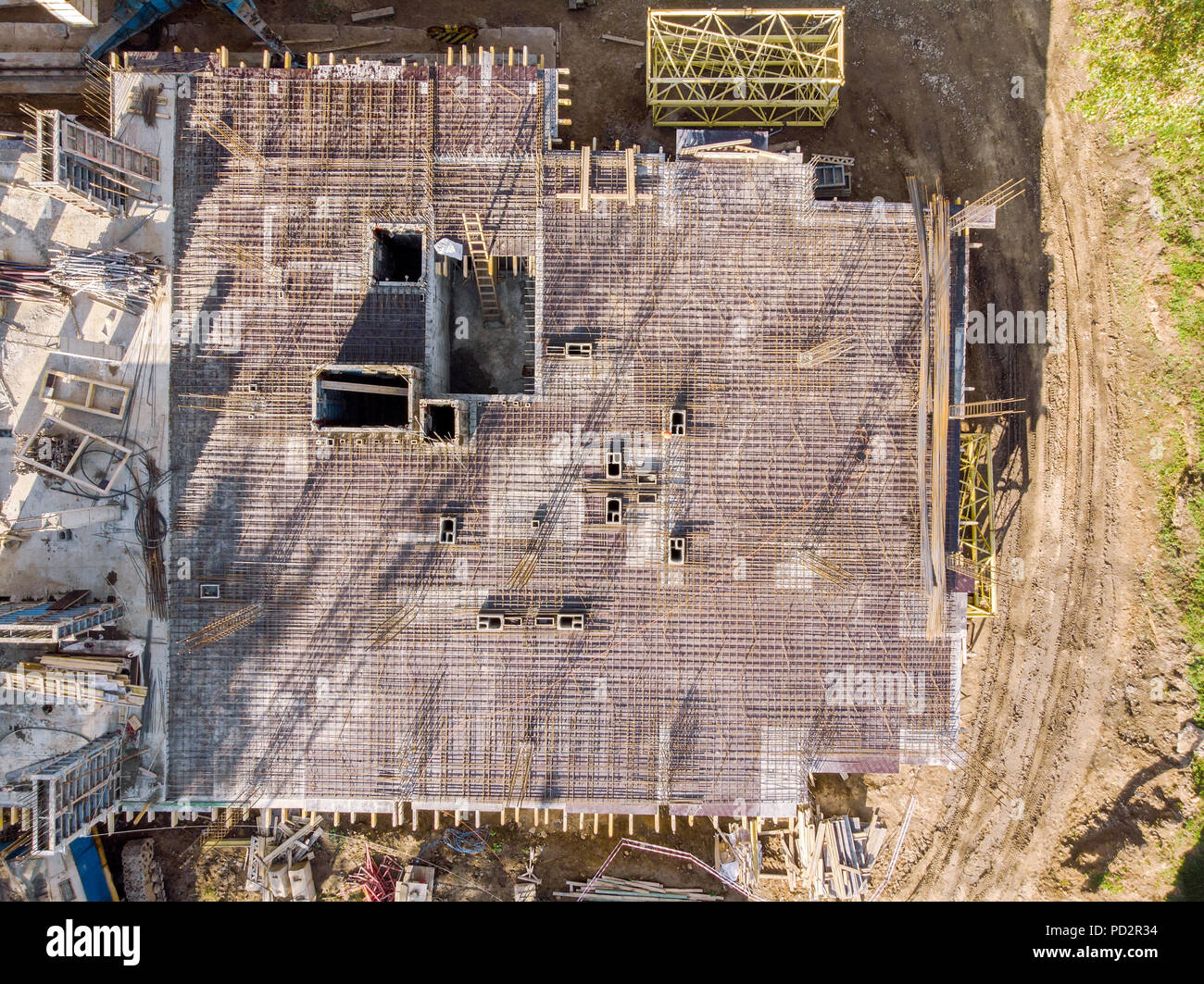 aerial top view of building under construction with steel rebars mesh for reinforced concrete Stock Photo