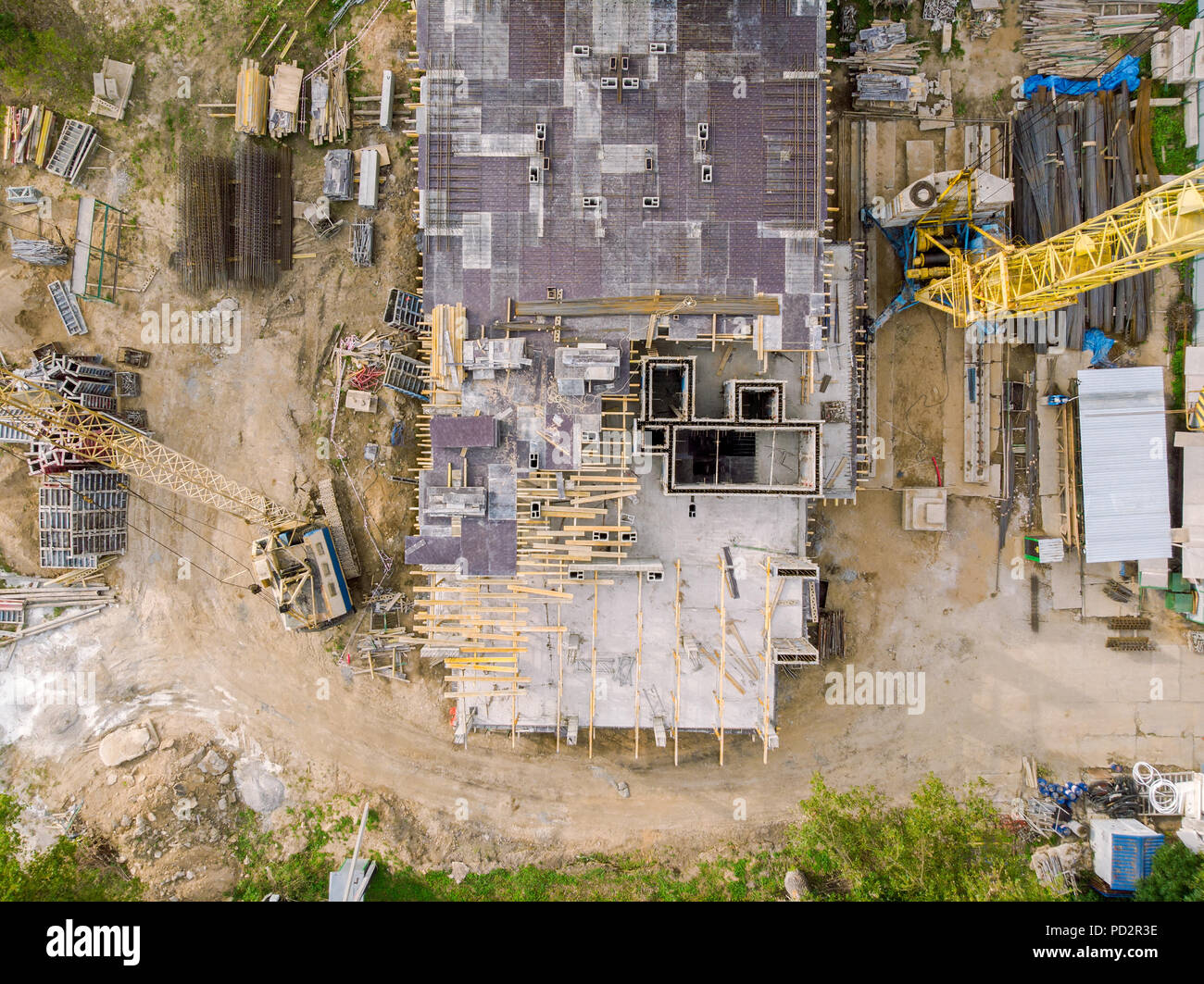 building construction site in progress with tower cranes. aerial top view Stock Photo
