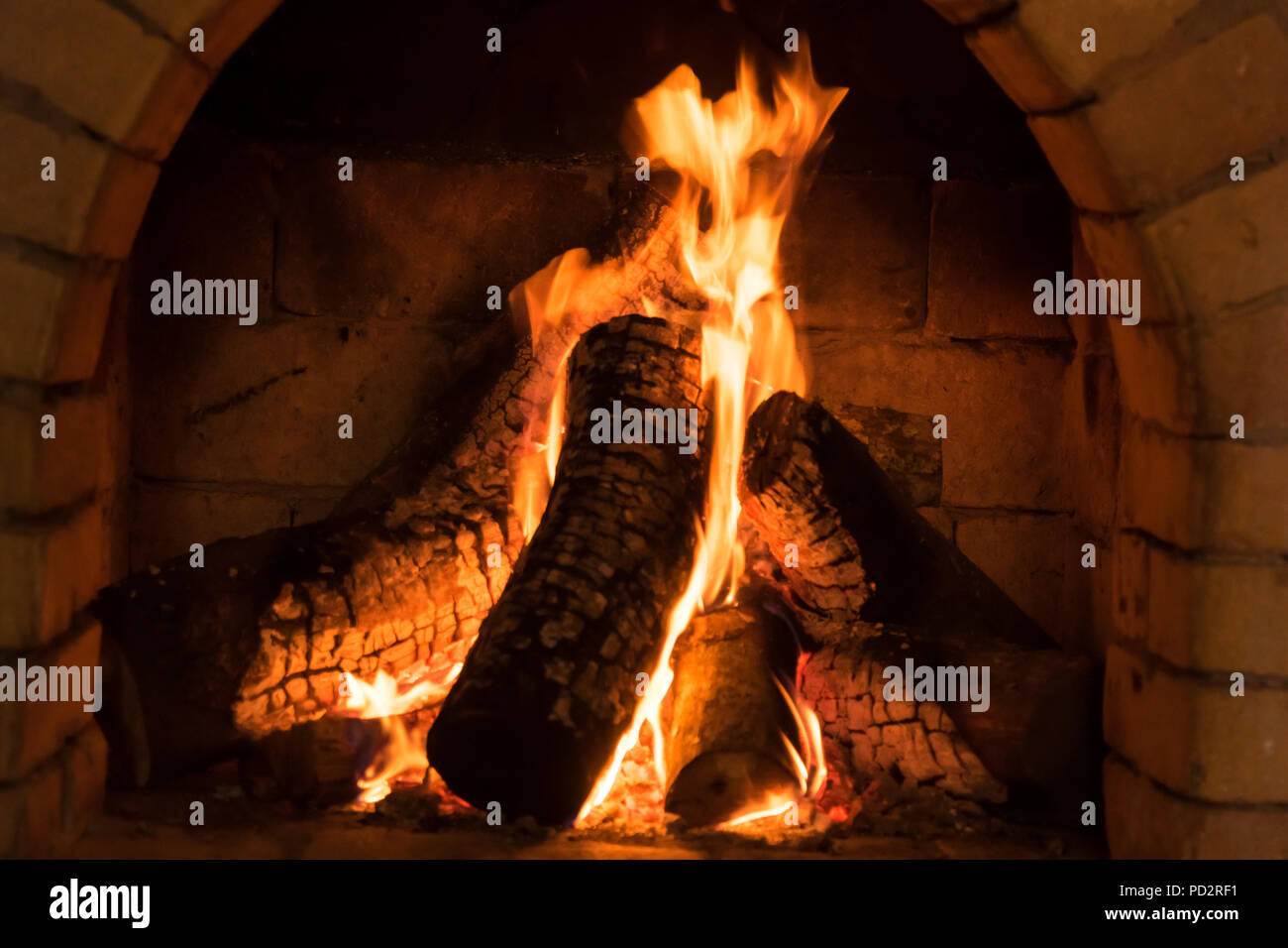 A fire burns in a fireplace, Fire to keep warm Stock Photo Alamy