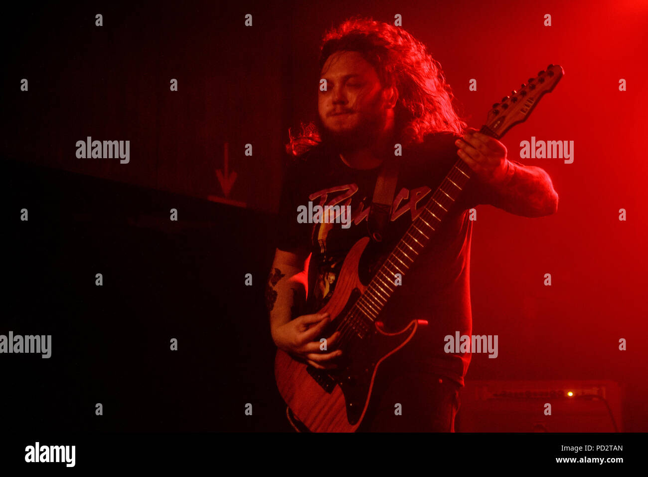 Denmark, Copenhagen - August 3, 2018. The American doom metal band Pallbearer performs a live concert at VEGA in Copenhagen. Here guitarist Devin Holt is seen live on stage. (Photo credit: Gonzales Photo - Peter Troest). Stock Photo