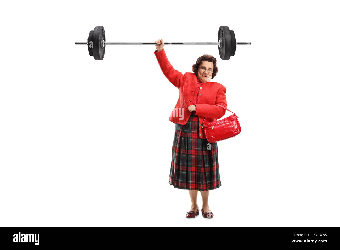 Full length portrait of a senior lady lifting a barbell with one hand isolated on white background Stock Photo