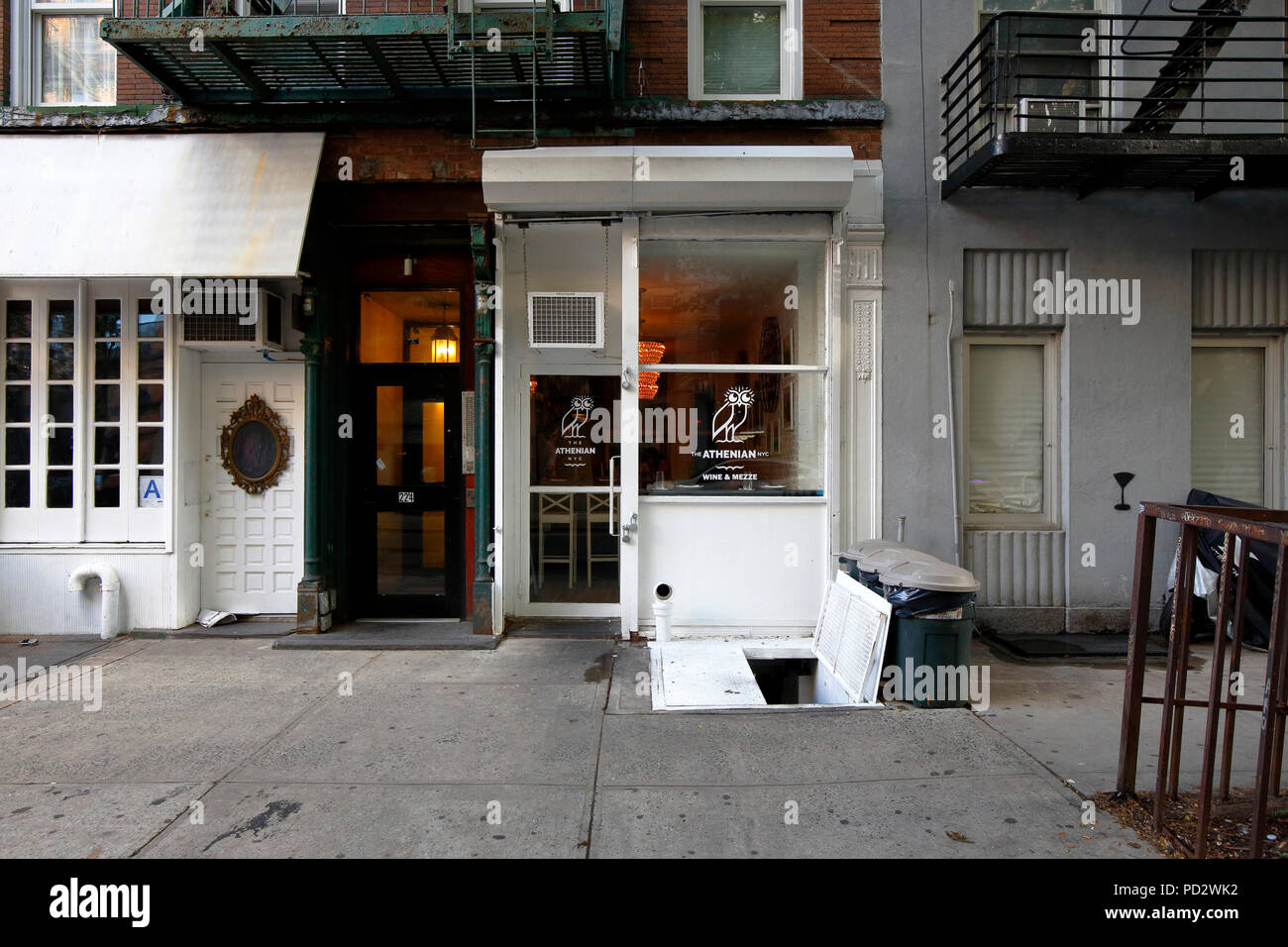 The Athenian, 224 E 10th St, New York, NY. exterior storefront of a wine bar in the East Village neighborhood of Manhattan. Stock Photo