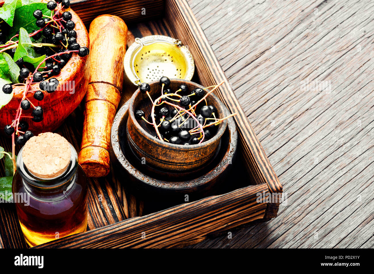 Birdcherry with green leaves and medicinal tincture.Alternative