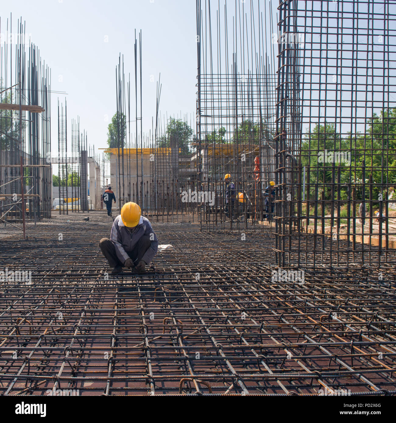 worker on strengthens and connects the reinforcement for the pouring
