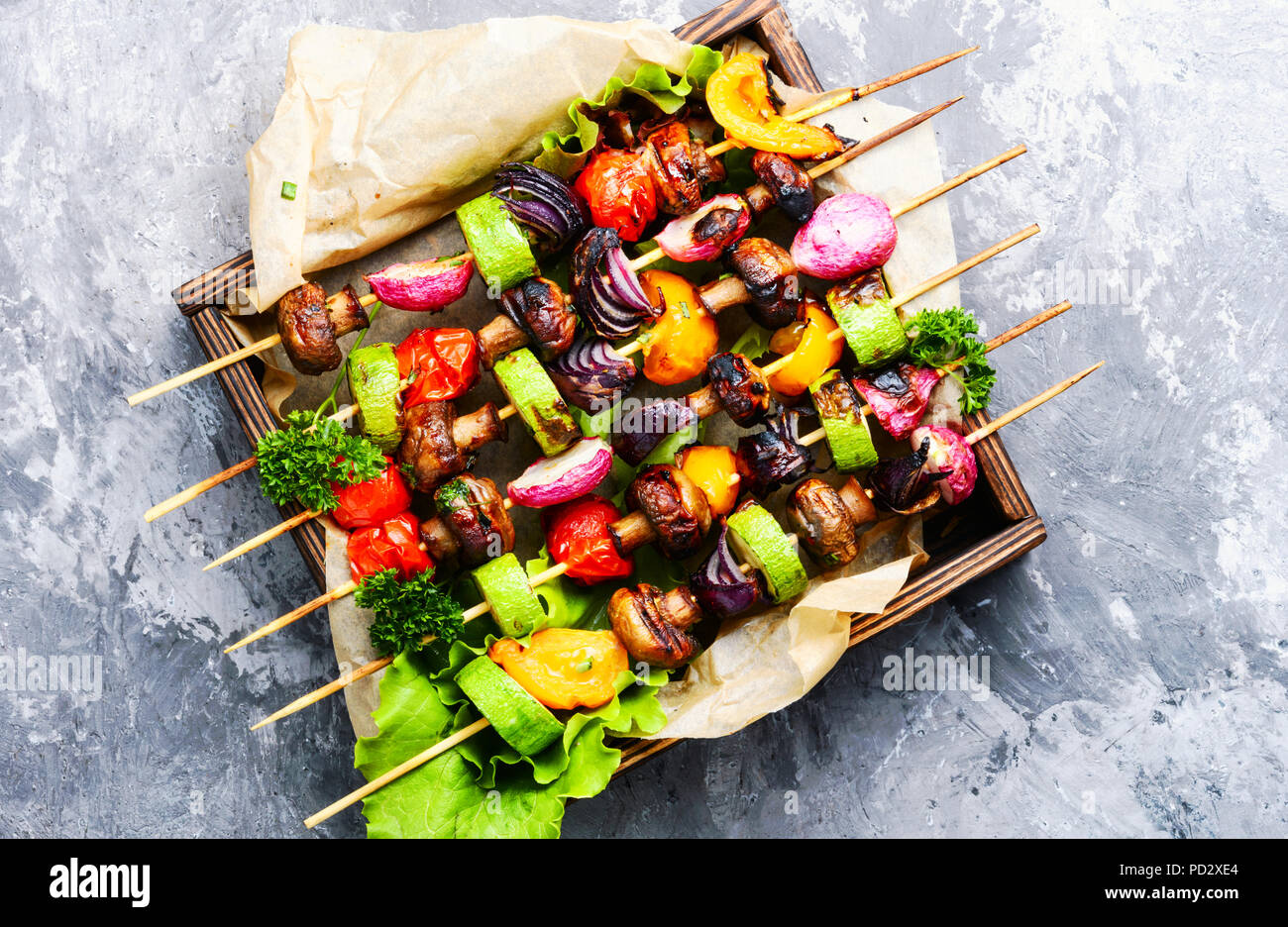 Grilled vegetable kebabs on skewers with tomato, pepper, mushrooms