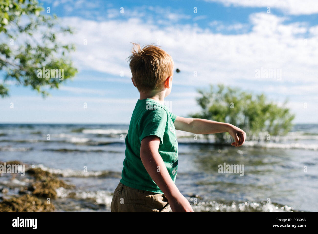Child throwing stone sea hires stock photography and images Alamy
