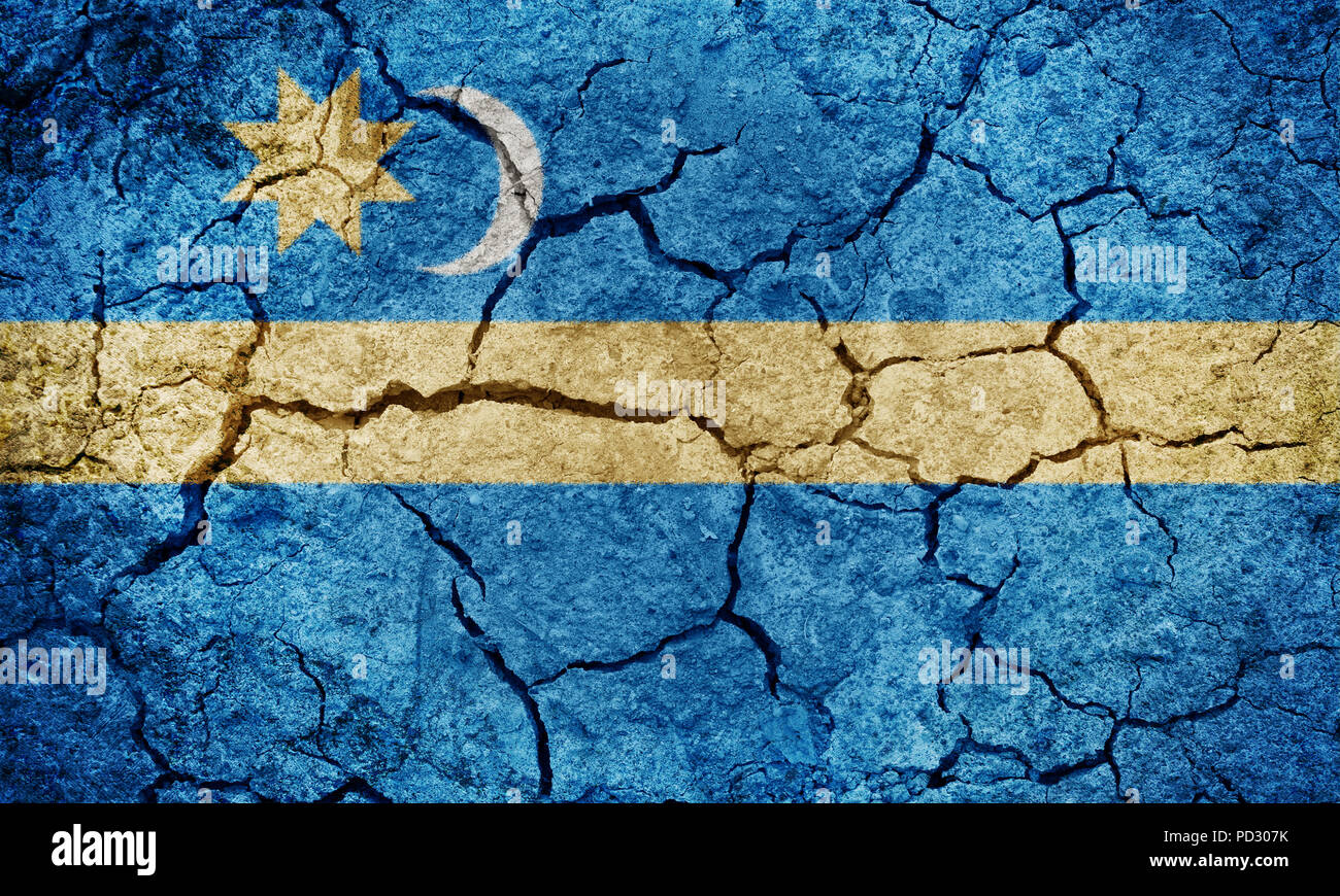 Szeklers flag on dry earth ground texture background, subgroup of the Hungarian people living in Romania Stock Photo