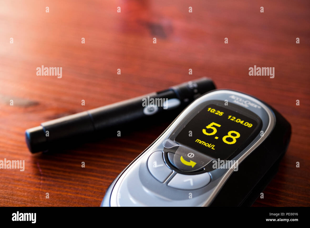 BG meter with lancing device on a kitchen table Stock Photo