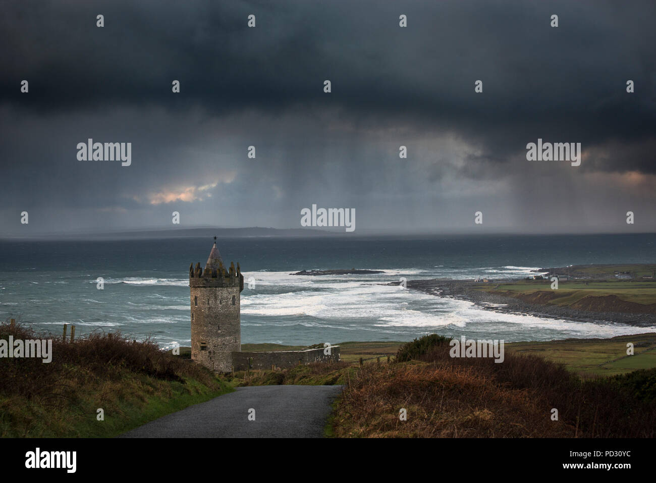 Stormy sky over Doonagore Castle, Doolin, Clare, Ireland Stock Photo