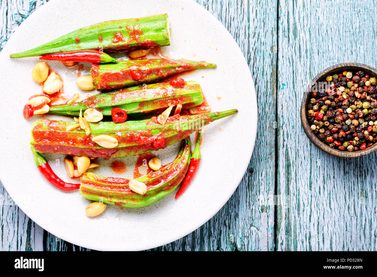 Indian spicy food from baked okra with spices.Vegetarianism Stock Photo