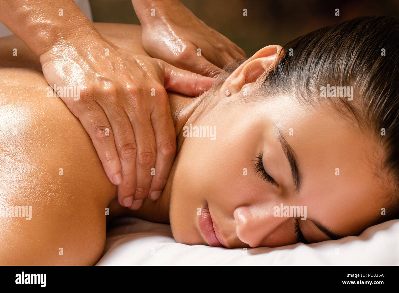 https://c8.alamy.com/comp/PD335A/close-up-of-woman-enjoying-revitalizing-shoulder-and-neck-massage-in-spa-PD335A.jpg
