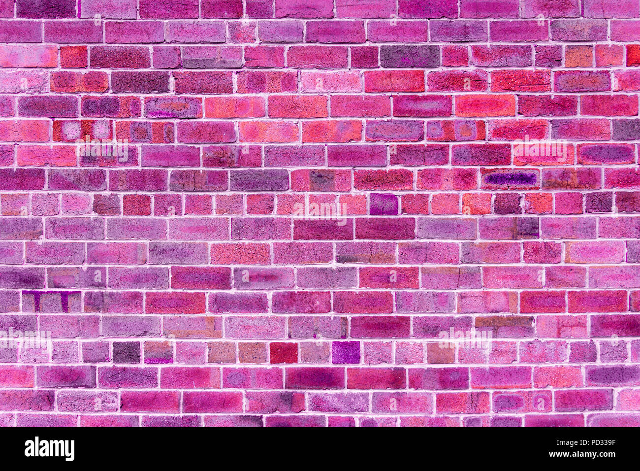 Close-up of brick wall with purple, pink, fuchsia, ultra violet, black color brick background Stock Photo