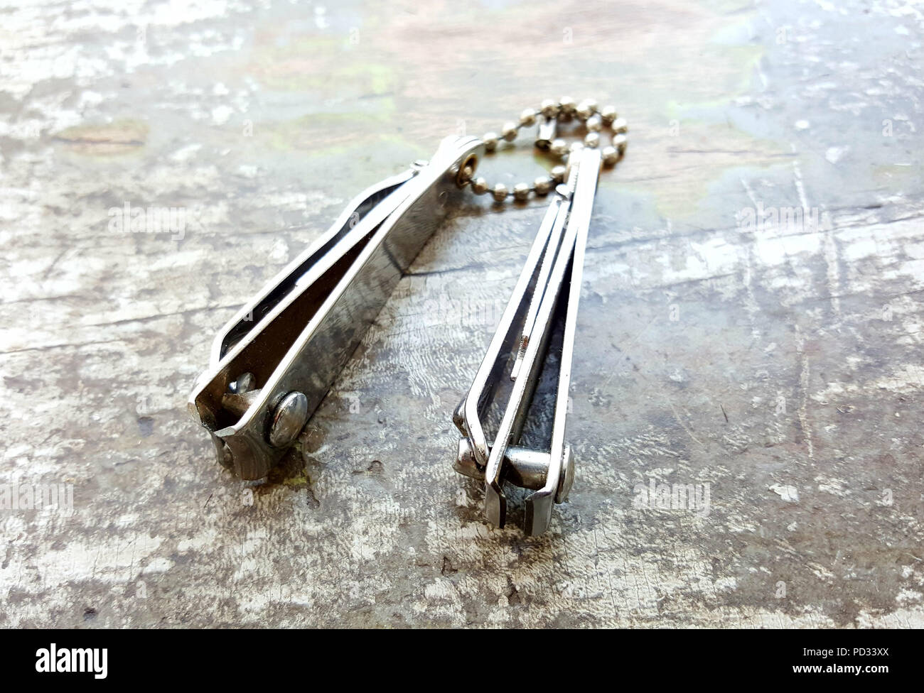 two nail clippers on wood background,image of a Stock Photo