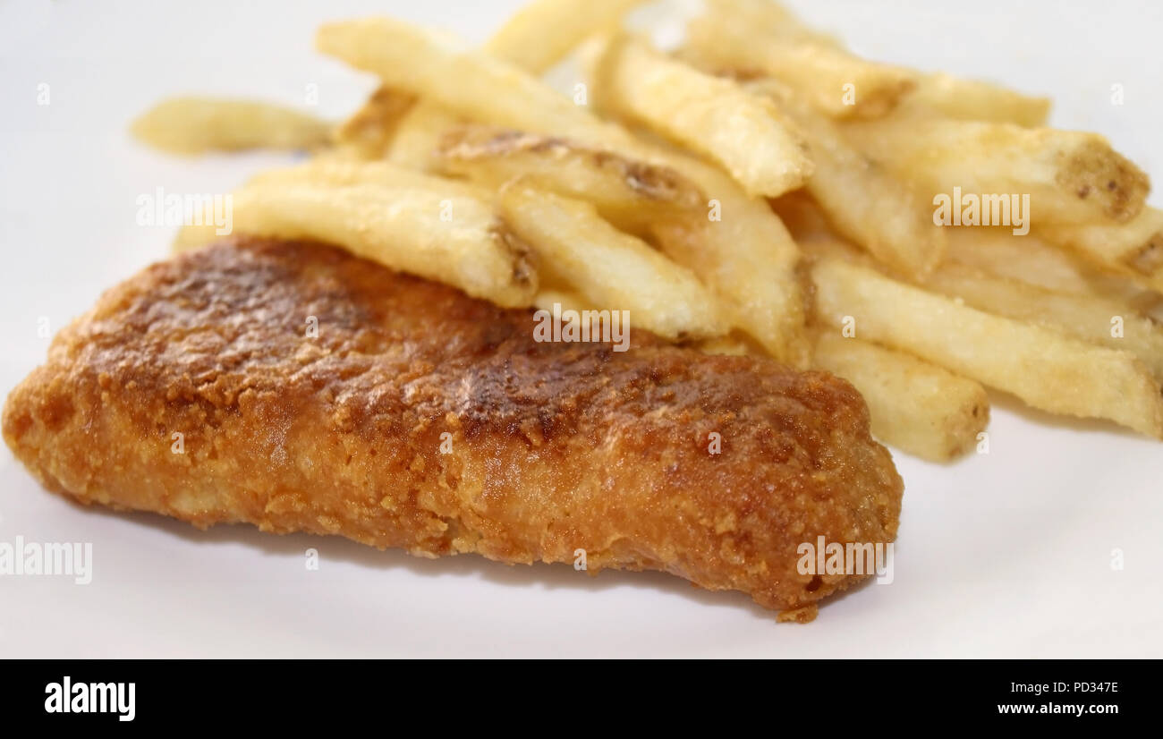 Oven baked fish portion with a side of french fries Stock Photo