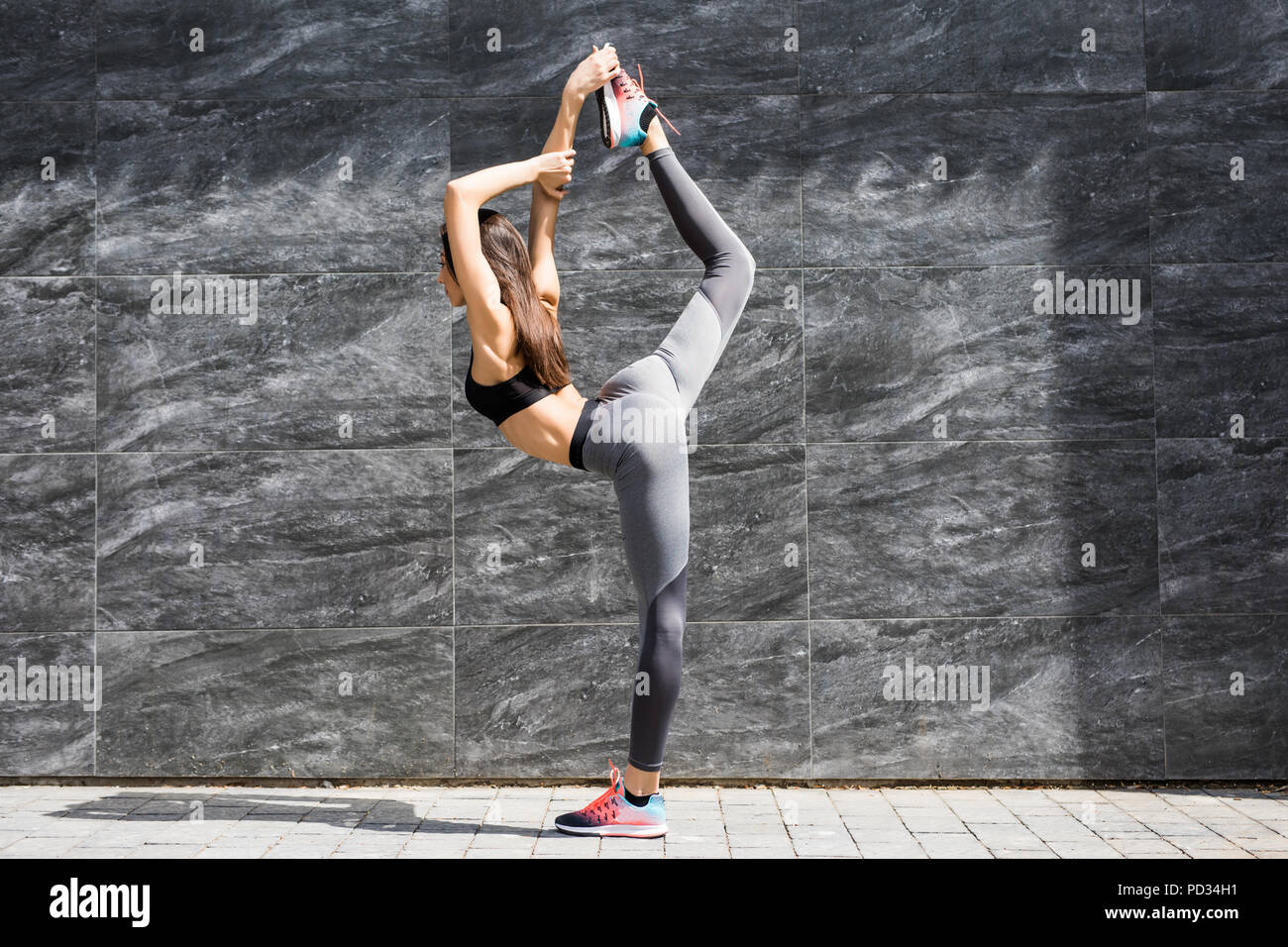Young Fitness Woman Doing Warm Up Exercise Before Running Stretching Her Leg By Performing Knee To Chest Stretch On The City Street Sporty Athlete Pr Stock Photo Alamy Young Fitness Woman Doing Warm Up Exercise Before Running Stretching Her Leg By Performing Knee To Chest Stretch On The City Street Sporty Athlete Pr Stock Photo Alamy