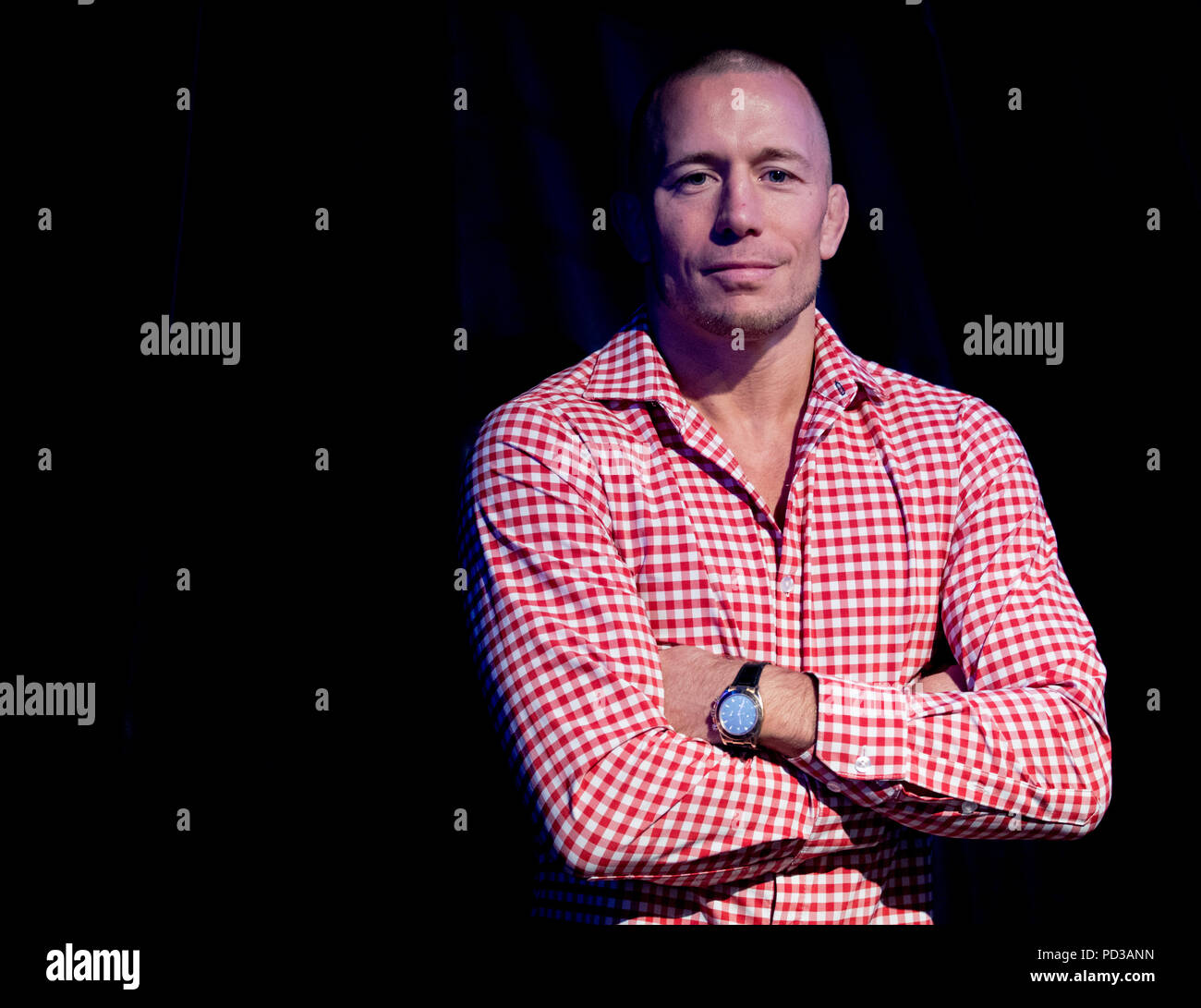 Sydney, Australia. 6th Aug, 2018. Ultimate Fighting Championship(UFC) player George St-Pierre reacts after press conference in Sydney, Australia, on Aug. 6, 2018. St-Pierre will give three speeches in Sydney, Melbourne and Brisbane this week to share the lessons he learned in mixed matrial arts. Credit: Zhu Hongye/Xinhua/Alamy Live News Stock Photo