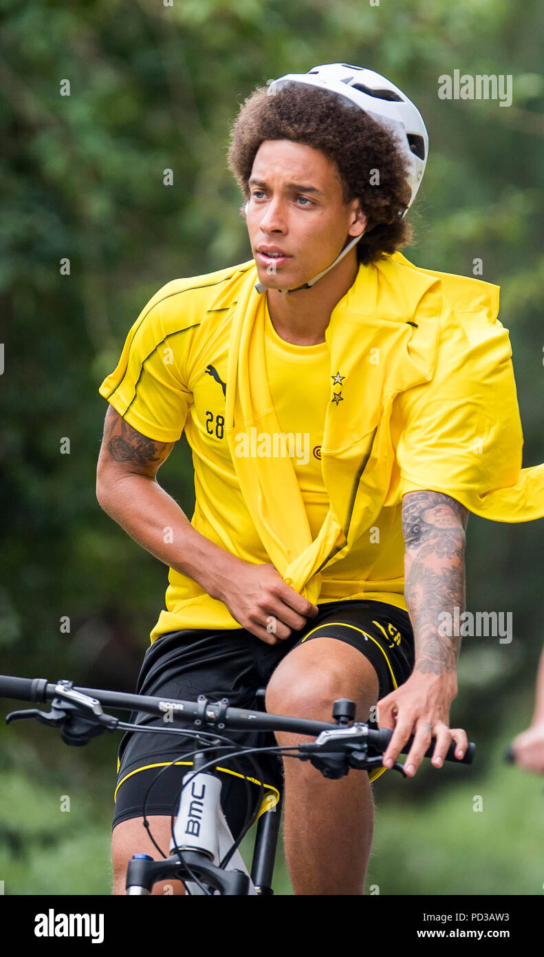 Bad Ragaz, Switzerland. 06th Aug, 2018. Football, training camp of team  Borussia Dortmund. Newcomer Axel Witsel rides his bike during practice.  Credit: David Inderlied/dpa/Alamy Live News Stock Photo - Alamy