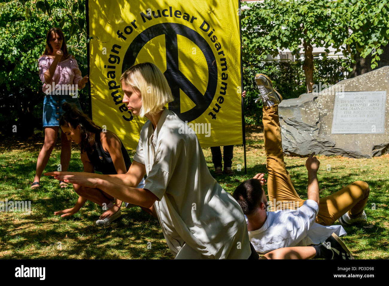 August 6, 2018 - London, UK. 6th August 2018. Movement artists Francesco Migliaccio, Fernanda Munoz-Newsome and Hannah Ekholm dance at the London CND ceremony in memory of the victims, past and present on the 73nd anniversary of the dropping of the atomic bomb on Hiroshima, also remembering those killed and living with the effects of radiation by the second atomic bomb dropped on Nagasaki three days later. The speeches included a reading in English of the statement made earlier in the day at the commemoration in Hiroshima, and an appeal by Rebecca Johnson, on of the founders of ICAN, awarded t Stock Photo